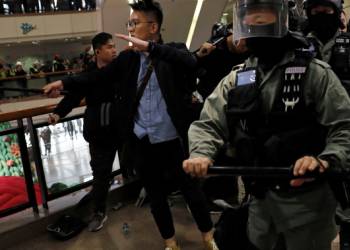 Hong Kong police fire tear gas at protesters in Christmas Eve shopping scuffle