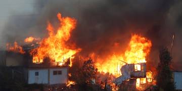 At least 120 homes affected by wildfire in hills over Chile metropolis, government says