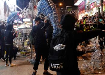 Hong Kong protesters form human chains, block roads in final hours of 2019