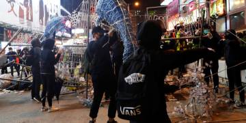Hong Kong protesters form human chains, block roads in final hours of 2019