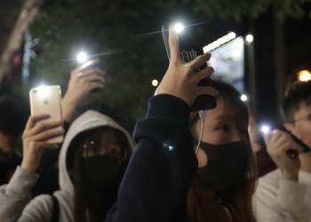 Bricks and tear gasoline: Hong Kong police, protesters clash as Carrie Lam visits Beijing