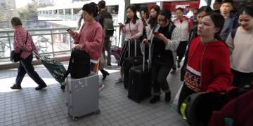 Marching through malls, Hong Kong protesters urge mainland Chinese traders to leave