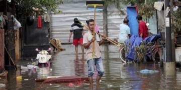 Nearly 400,000 people displaced by Indonesia floods as rescuers search for victims