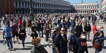 Tourist spots, beaches already teeming after coronavirus lockdowns eased around the world