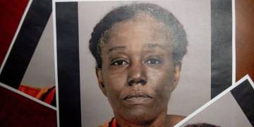 Woman charged in fatal shooting of dollar store guard over mask policy in Michigan