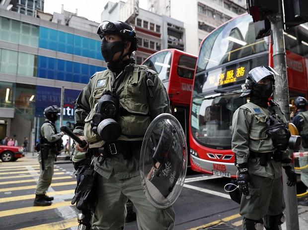 Hong Kong riot police crackdown on protesters rallying for China's Uighurs